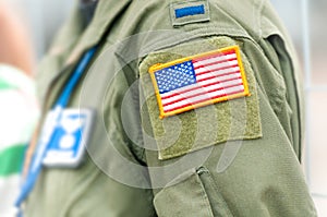 Focus on american flag on USAF uniform of person.