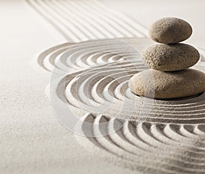 Focus on balancing stones in sand for progression