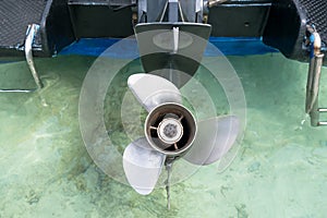 Focus on boat propeller on the water
