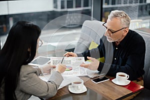 Focus of businessman holding papers and