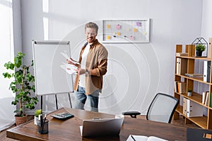 Focus of businessman holding papers near