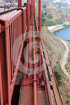 Focus on the cables and support beam of the Golden Gate Bridge looking towards Vista Point, Marin County