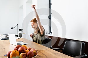 Focus of cheerful woman showing yeah