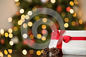 Focus on christmas gift and pine cone