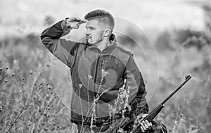 Focus and concentration of experienced hunter. Hunting and trapping seasons. Man brutal gamekeeper nature background