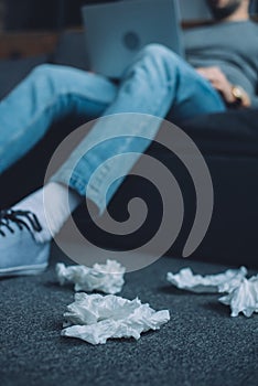 Focus of crumpled napkins on floor