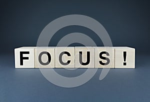 Focus. Cubes form the word Focus. The concept of the word Focus