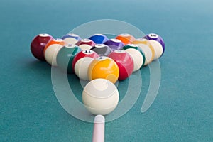 Focus on cue aiming white ball to break snooker billards