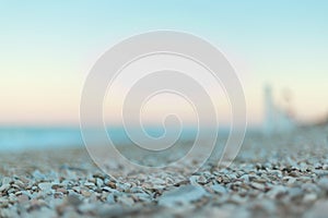 Focus Detail on Morning light stones on beach close to the shore