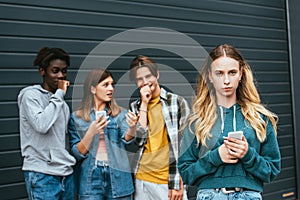 Focus of girl with smartphone standing