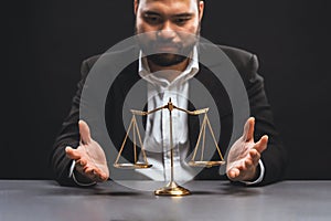 Focus golden scale balance with burred background of lawyer. equility