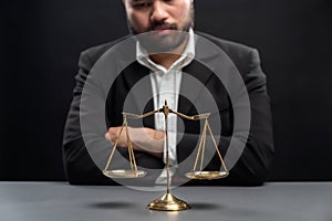 Focus golden scale balance with burred background of lawyer. equility