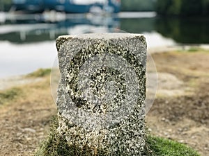 Focus on a granite mooring post