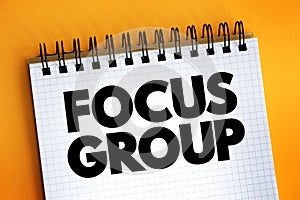 Focus Group text on notepad, concept background