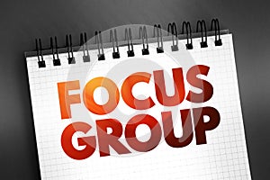 Focus Group text on notepad, concept background