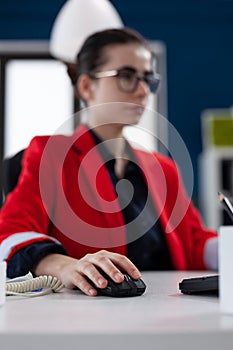 Focus on hand of businesswoman holding computer mouse