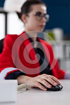 Focus on hand of businesswoman holding computer mouse