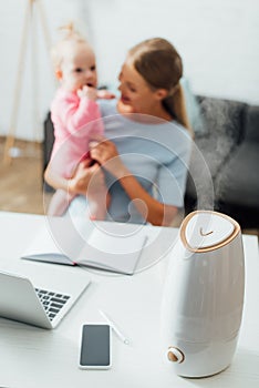 Focus of humidifier near gadgets on