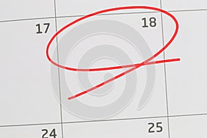 Focus on number 18 in calendar and empty red ellipse.