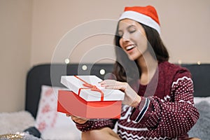 On focus opened Christmas present in women`s hands