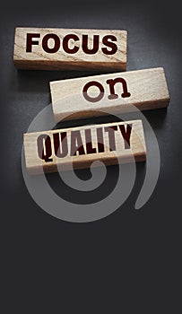 Focus on Quality words of on wooden blocks. Honesty in business concept