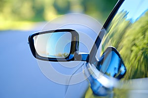 Focus on rear view mirror of a car