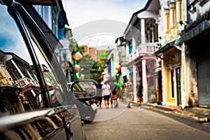 Focus at sideview mirror of a car in phuket old town.