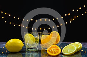focus at slice fresh orange and lemon in juice glass