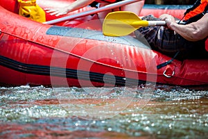 Focus some part of young person are rafting in river.