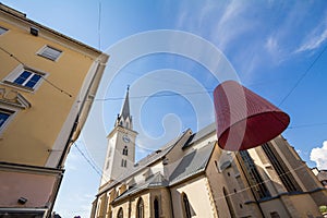 Focus on Stadtpfarrkirche Sankt Jakob, the parish church of saint jacob, in the city center of Villach, in Carinthia, Austria,