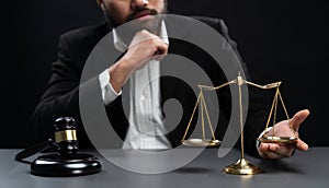 Focus symbols of justice on blurred background of lawyer. equility
