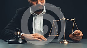 Focus symbols of justice on blurred background of lawyer. equility