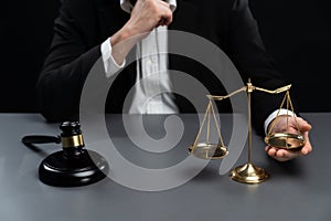 Focus symbols of justice on blurred background of lawyer. equility