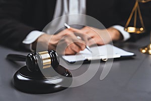 Focus symbols of justice on blurred background of lawyer signing. equility