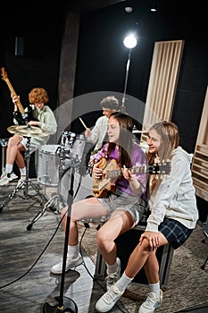 focus on teenage girls with guitar
