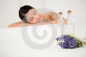 Focus on two massage oil bottles