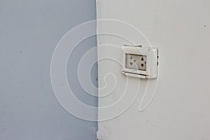 Focus white plug socket 2 chanels on the wood wall. electricity for house and city.
