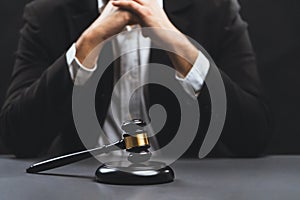 Focus wooden gavel with burred background of lawyer. equility