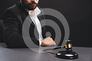 Focus wooden gavel with burred background of lawyer. equility