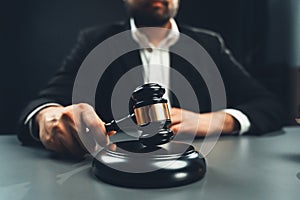 Focus wooden gavel with burred background of lawyer. equility