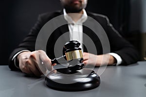 Focus wooden gavel with burred background of lawyer. equility