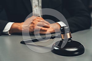 Focus wooden gavel with burred background of lawyer. equility