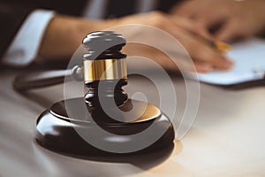 Focus wooden gavel hammer on blur background. Equilibrium