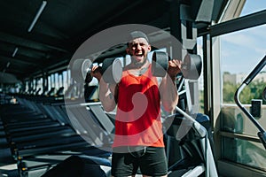 Focused Athlete Caucasian man Dumbbell Training in Gym