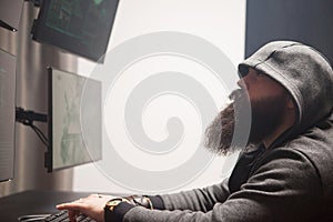 Focused bearded hacker to destroy the system