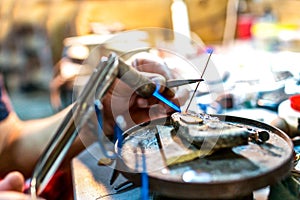 Focused brazing in progress at jewelry workshop