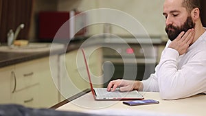 Focused business man entrepreneur typing on laptop doing research
