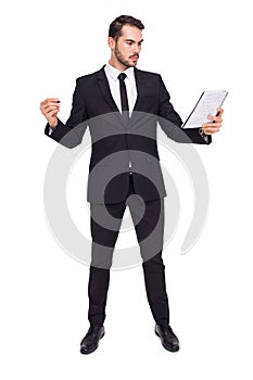 Focused businessman holding pen and notebook