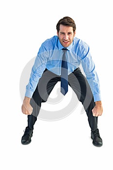 Focused businessman lifting up something heavy