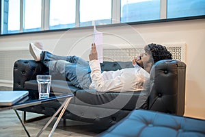 Focused businessman reading documents in his office